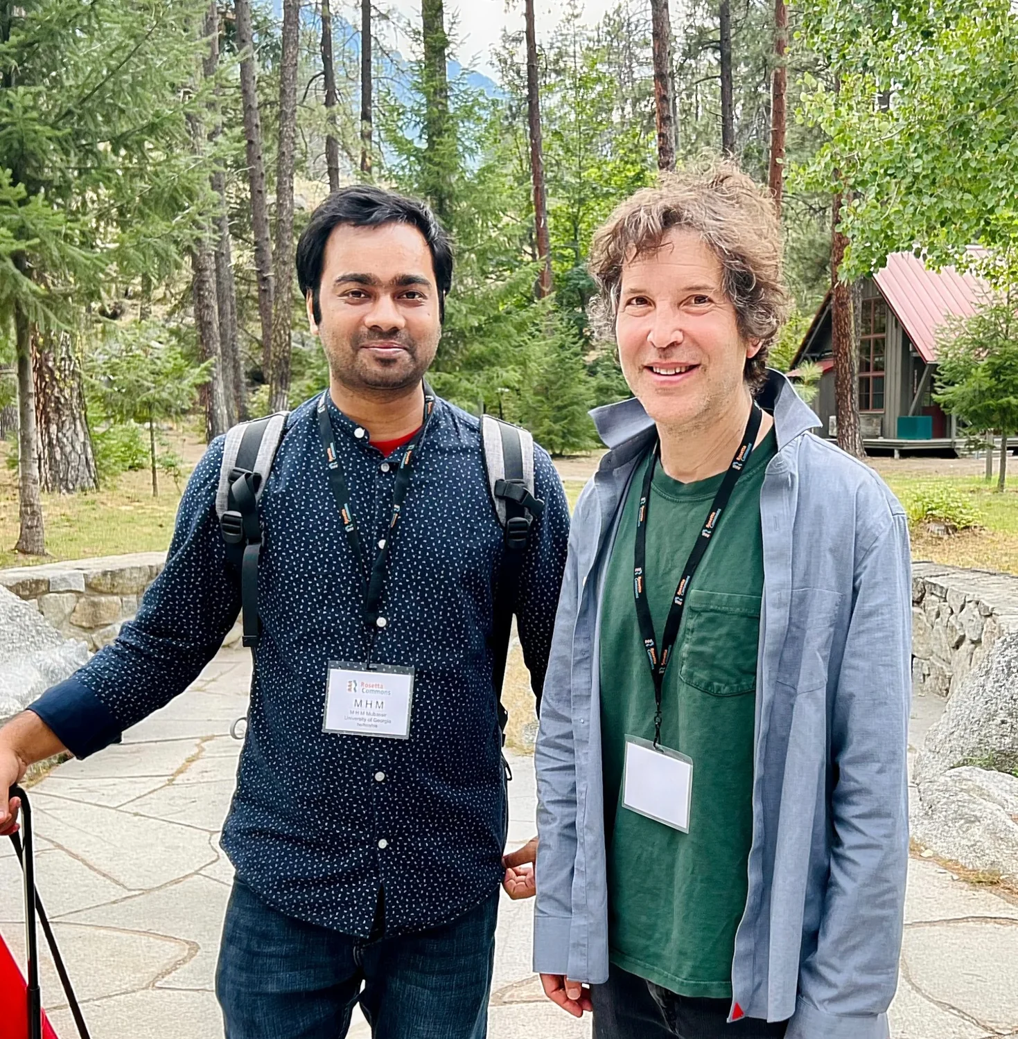 M H M Mubassir discussing protein structure with a colleague